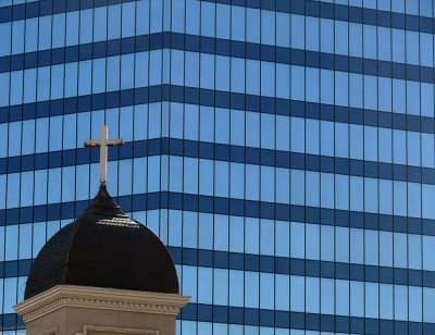 Spandrel panels appear as dark horizontal bands on this high rise building.