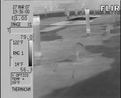 Light gray areas indicate extent of wet foam insulation in a built-up roof. Note the solid thermal pattern typical of absorbent insulation. Thermogram provided by Jersey Infrared Consultants